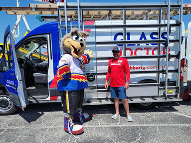 Glass Doctor of the Gulf Coast Touch-a-Truck Glass repair and replacement specialists Glass Doctor of the Gulf Coast participating in the Touch-a-Truck competition and posing with a local sports mascot.